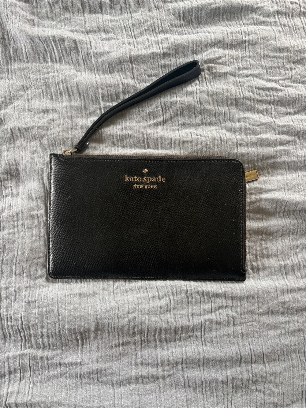 kate spade black leather wristlet with gold logo